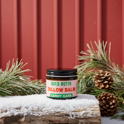Candy Cane Tallow Skincare on a log outside
