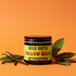 Wild Buttr Tallow tobacco vanilla with orange background and vanilla stem