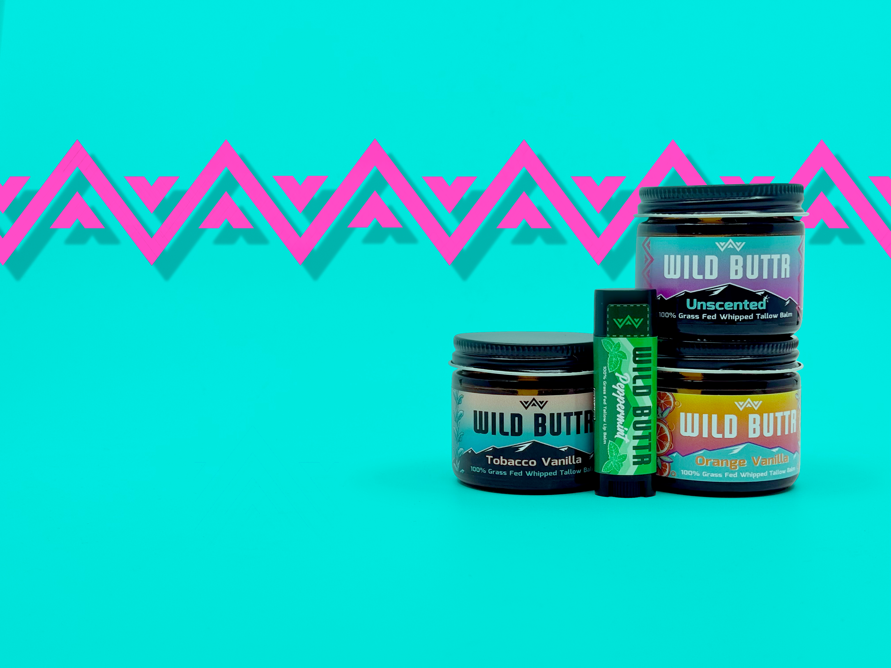 Wild Buttr full skincare collection with 4 grass-fed tallow products on a blue background for clean, organic skin nourishment